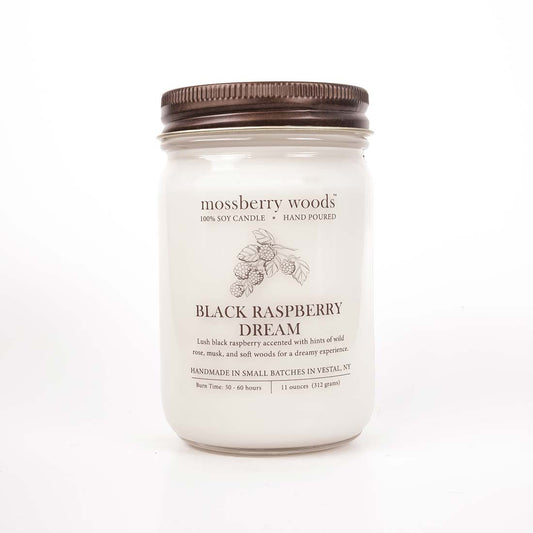 Black Raspberry Dream Country Cottage candle in a mason jar with a rustic brown lid on a white background