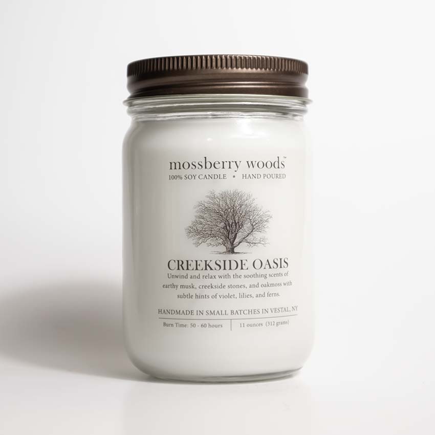 Creekside Oasis Country Cottage Candle with a rustic brown lid