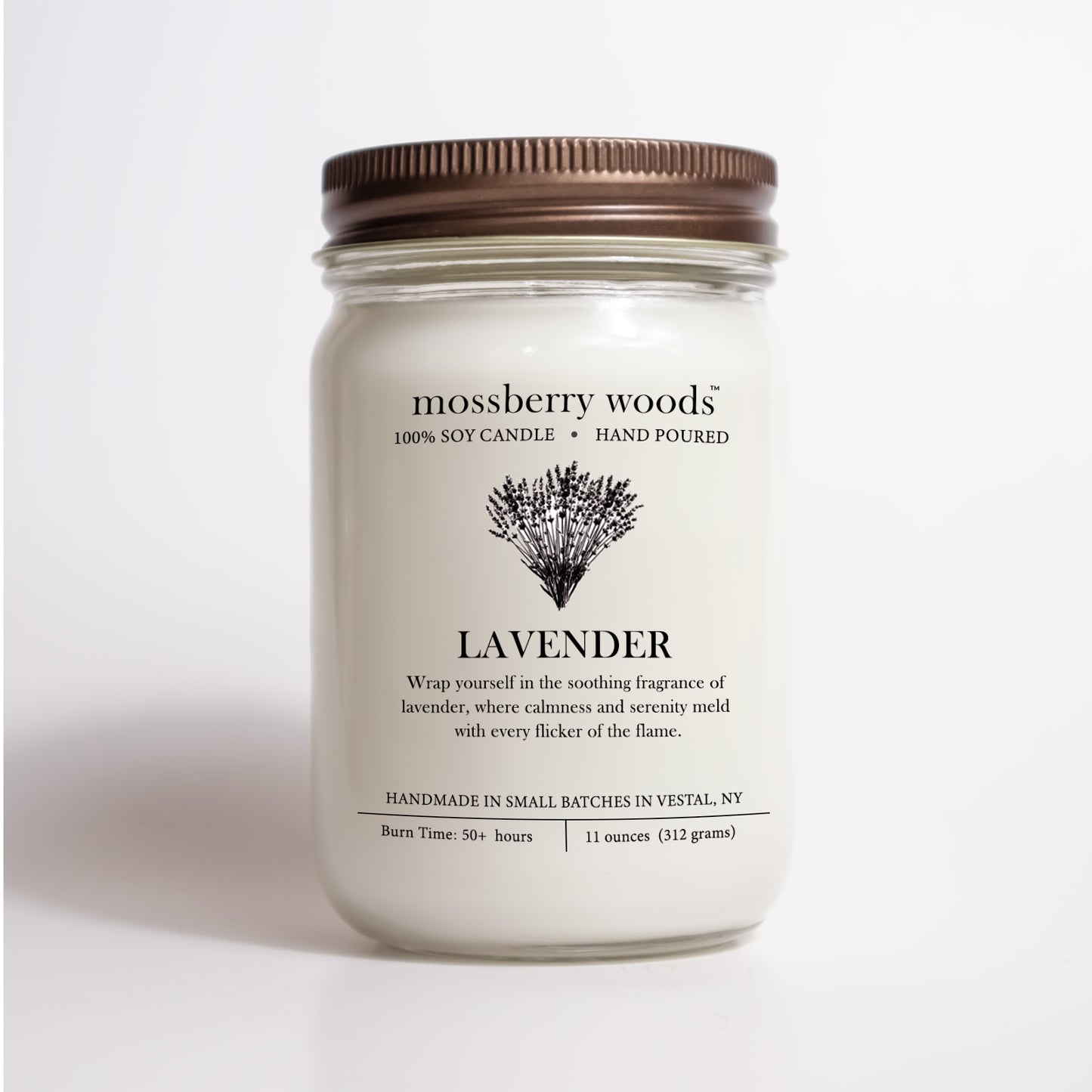 A lavender mason jar candle with a brown lid with a label that reads Lavender with an illustration of a bouquet of lavender flowers.