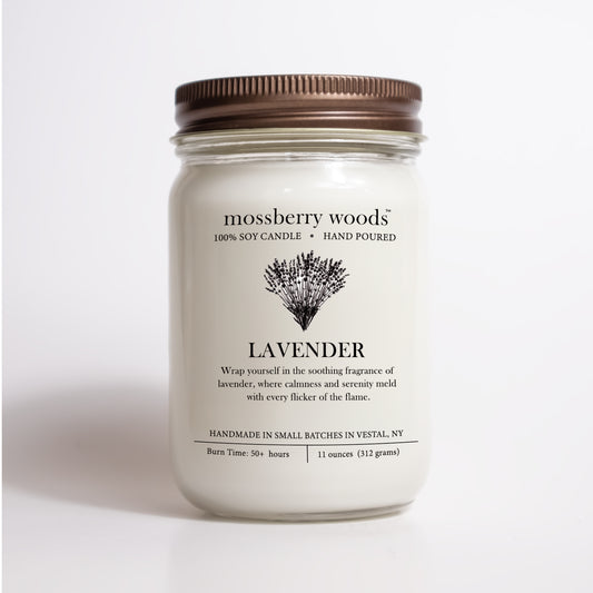 A lavender mason jar candle with a brown lid with a label that reads Lavender with an illustration of a bouquet of lavender flowers.