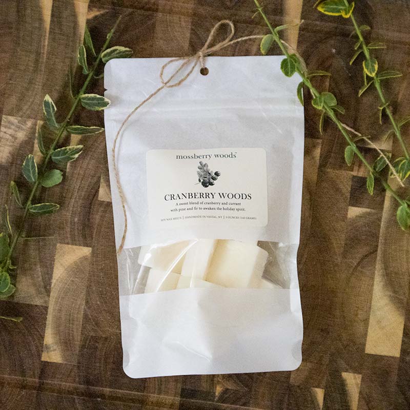Bag of Cranberry Woods soy wax melts with an illustration of cranberries