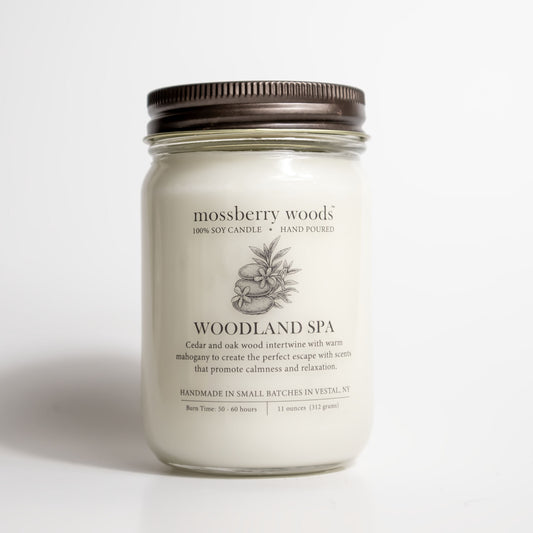 Woodland Spa mason jar candle with a rustic brown lid on white background