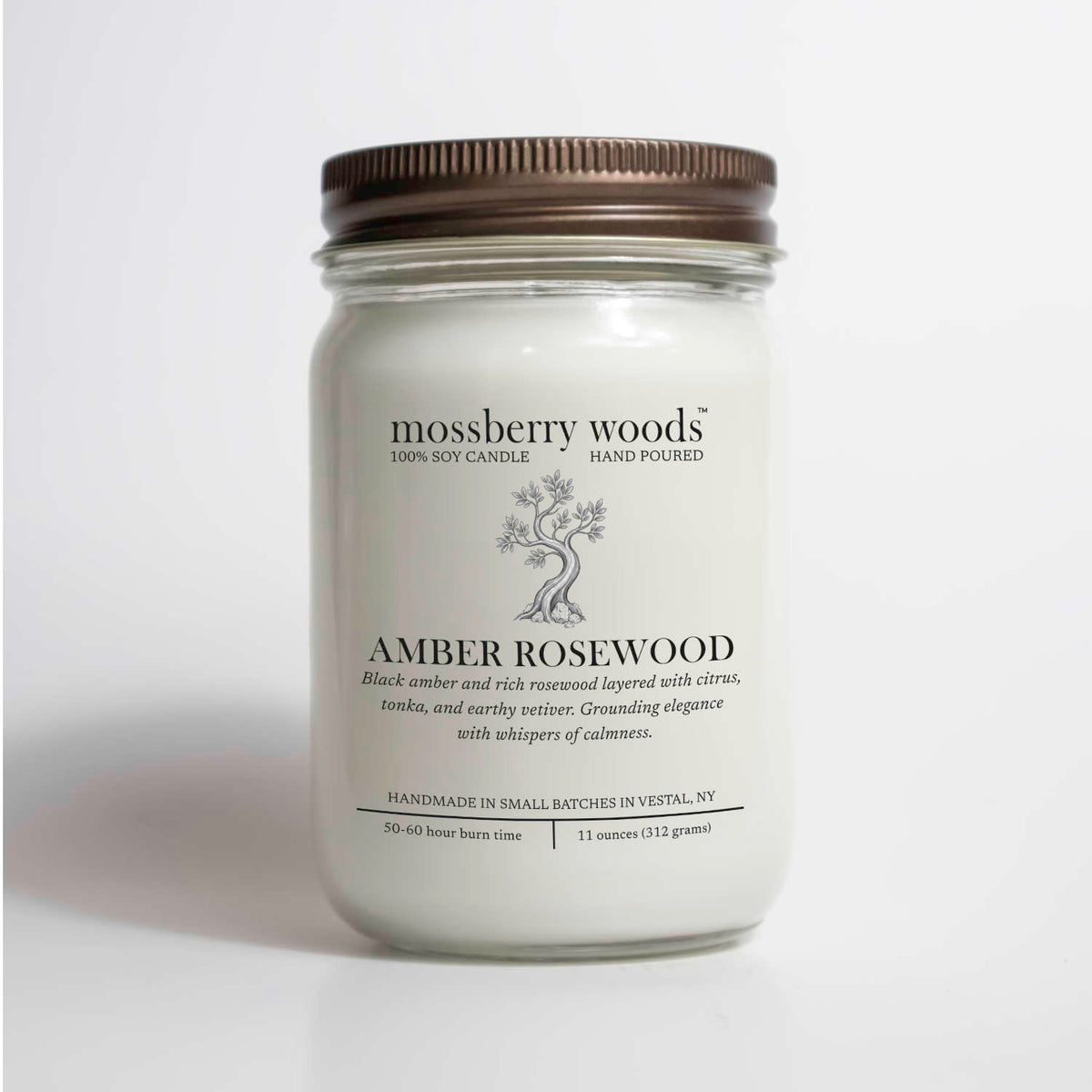 Amber Rosewood scented soy candle in a 12oz mason jar on a white background