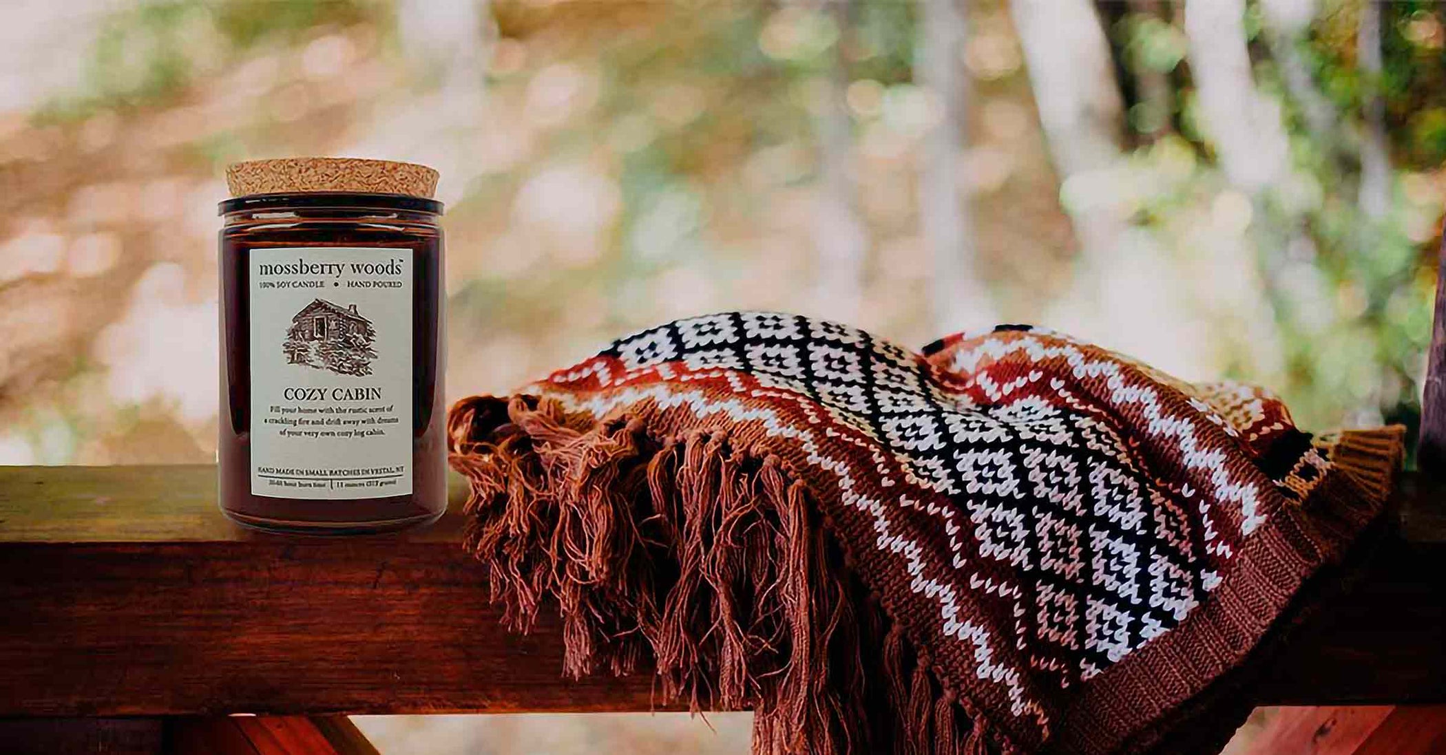 Rustic candle on a porch railing in the fall