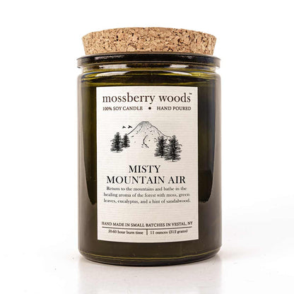 Misty Mountain green rustic candle with cork lid and a mountain scene on the label