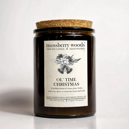 Ol' Time Christmas candle in an amber jar with a cork lid