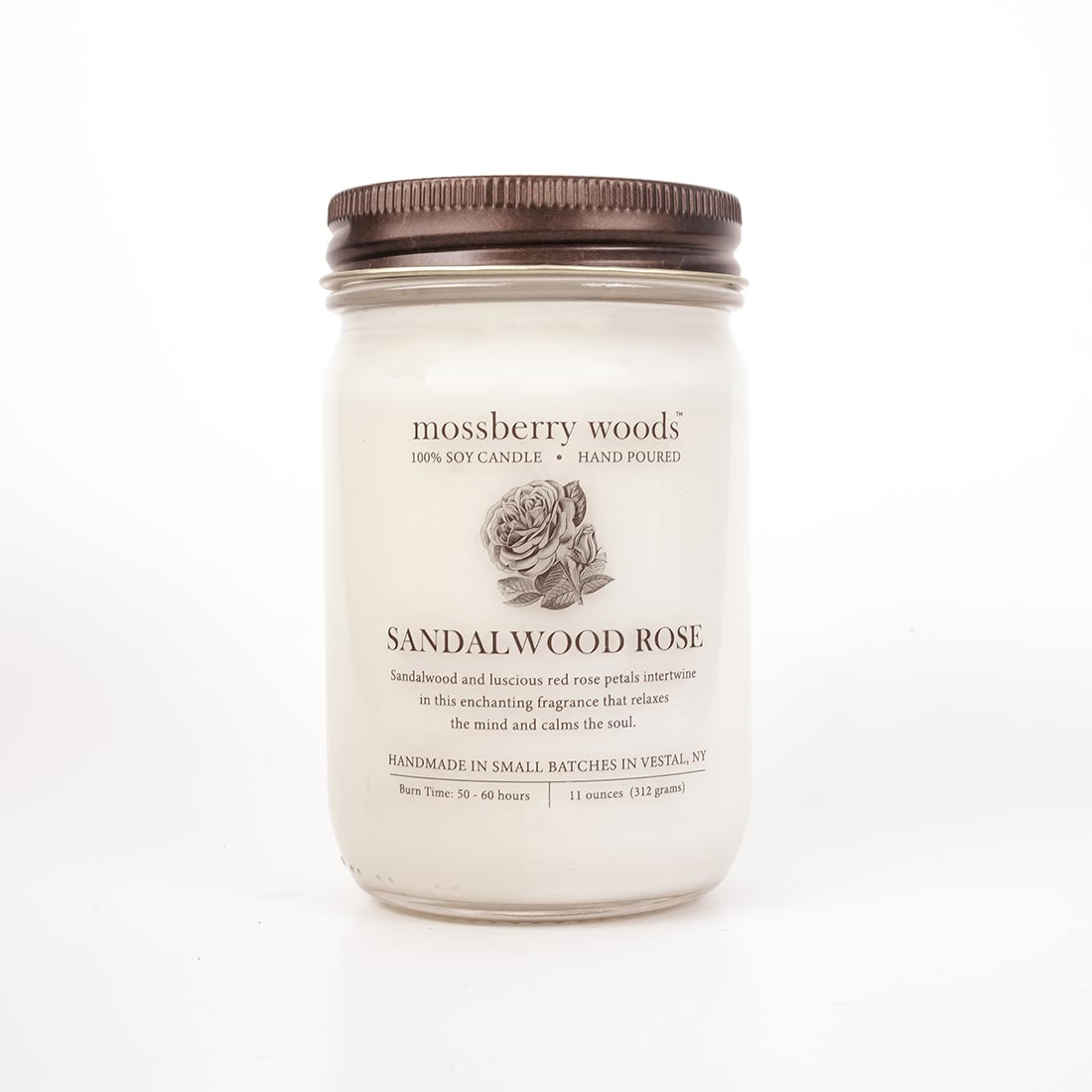 Sandalwood Rose soy candle in a mason jar with a rustic brown metal twist lid