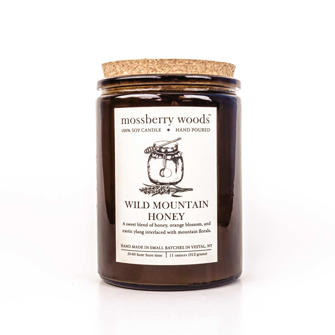 Wild Mountain Honey in rustic amber jar with a cork lid on a white background