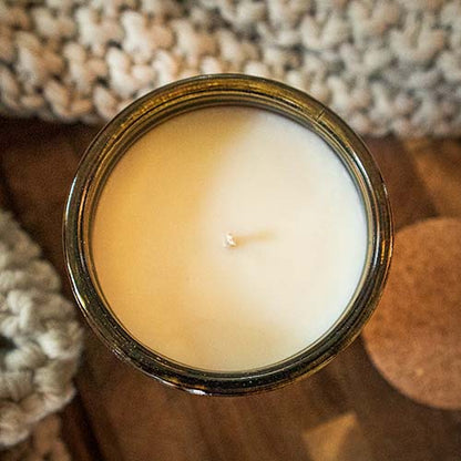 top view of a rustic candle in vintage green jar