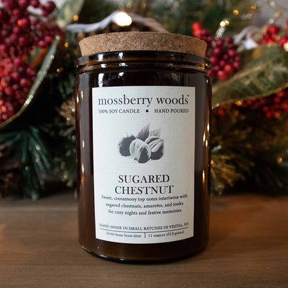 Sugared Chestnut rustic candle in an amber jar on a wood table