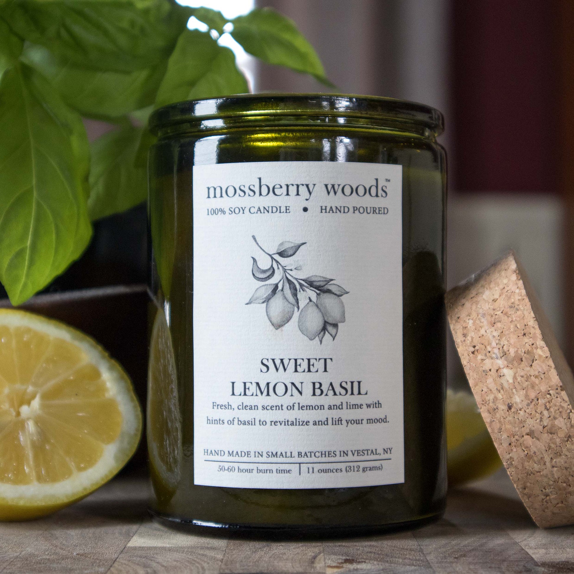 https://mossberrywoods.com/cdn/shop/products/sweet-lemon-basil-candle-rustic-scene-2_f9cbce21-a625-428e-a3eb-a91c7db0a294_1946x.jpg?v=1674662822